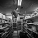 Abdullah Ferdous, who works as an electrician, changes a lighting fixture at a food market in Brooklyn.